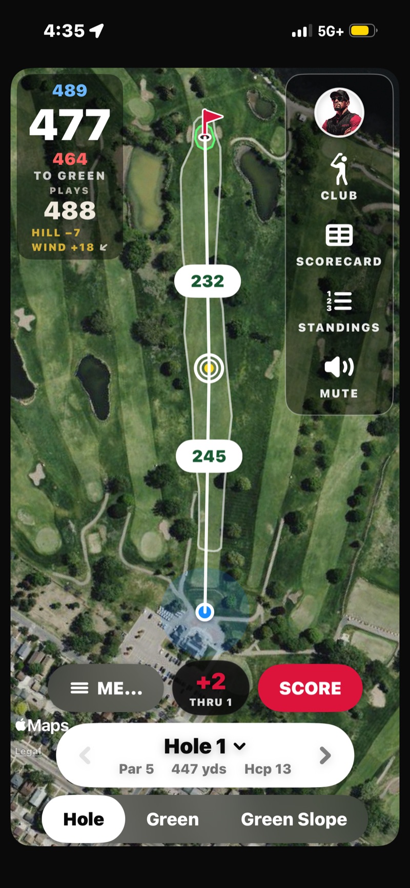 FOREPAID GPS Hole View on a par 5 from an earlier build: 477 yards to the middle that plays 488 after 7 yards of downhill and 18 of wind against, back 489 and front 464, layup distances along the aim line, and the Golfcaster rail with CLUB, SCORECARD, STANDINGS and MUTE
